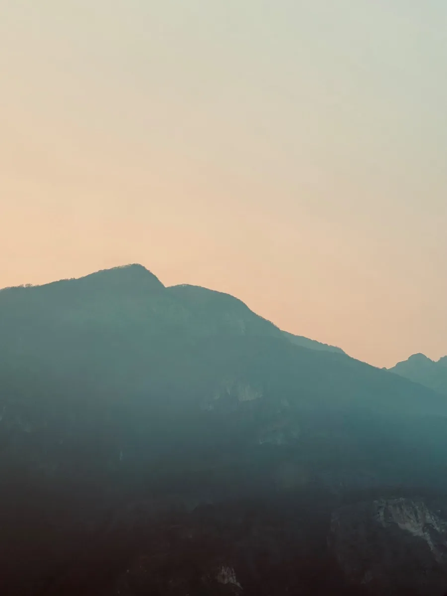Layered mountains at sunset